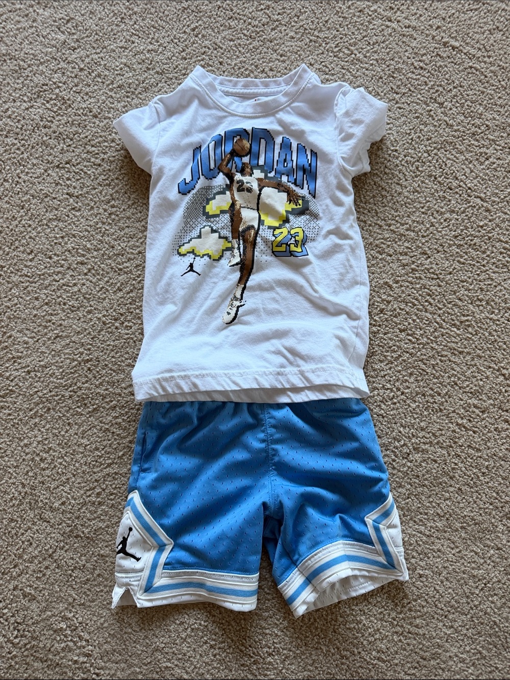 Jordan White Graphic Tee with Blue Athletic Shorts
